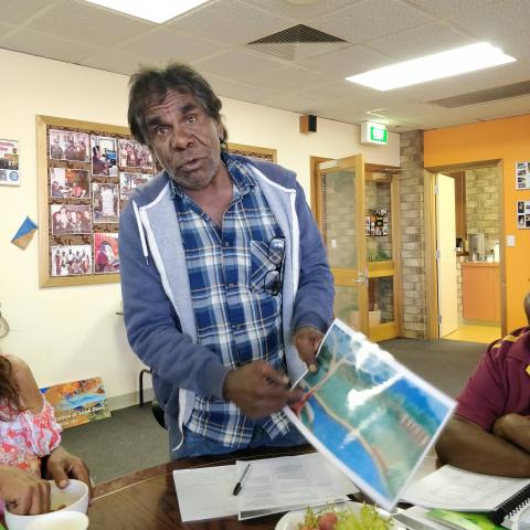 A man pointing to a map